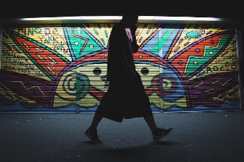 Free man walking pass mural | Free Photo - rawpixel