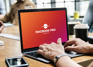 Free Person Using MacBook Pro Mockup PSD macbook pro mockup 