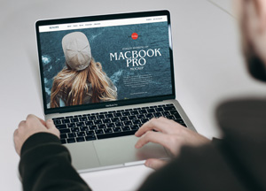 Free Person Working on MacBook Pro Mockup macbook pro 