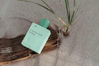 Free Perspective Bottle on Beach Mockup