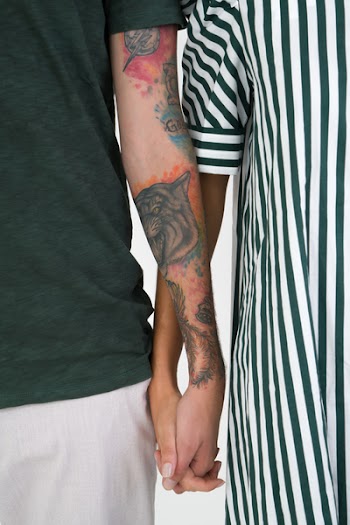 Free Photo of Couple, holding hands, tattoos