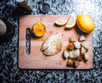 Free Photo of fish, lemon, chopping board