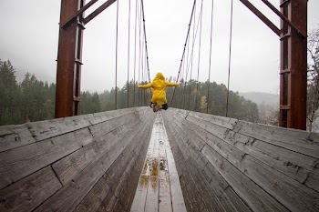 Free Photo of jump, rain, raincoat
