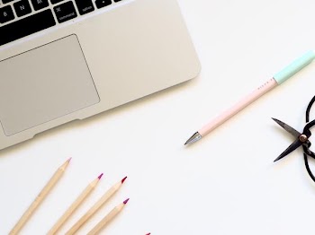 Free Photo of macbook, pens, pencils