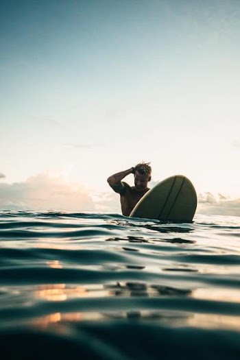 Free Photo of man, sufboard, sea