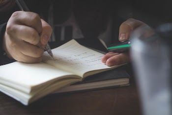Free Photo of notebook, pen, hand