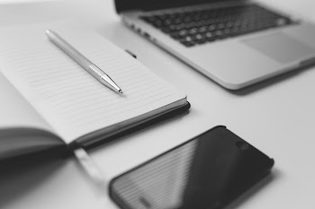 Free Photo of notepad, pen, iphone