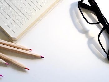 Free Photo of notepad, pencils, glasses