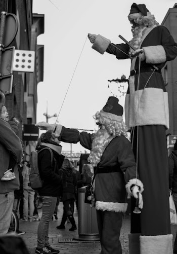 Free Photo of santas, marionettes, stilts