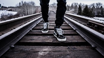 Free Photo of shoes, sneakers, train tracks