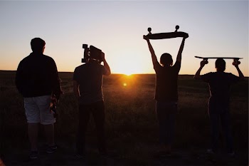 Free Photo of sunset, skaters, skateboards