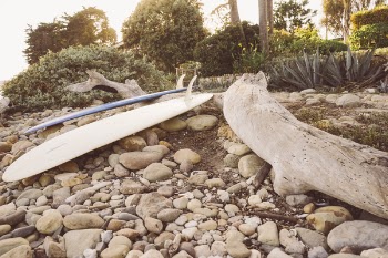 Free Photo of surfboard, rocks, dirt