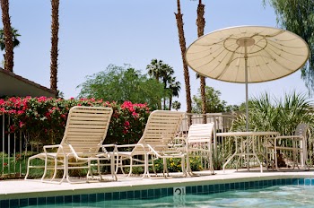 Free Photo of swimming pool, umbrella, patio chairs