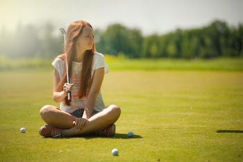 Free Photo of woman, cross legged, golf