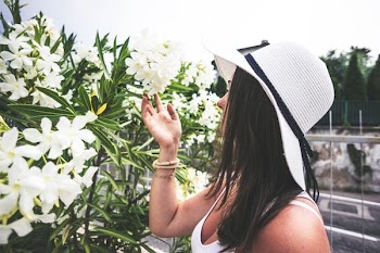 Free Photo of woman, smelling, flowers