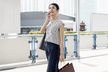 Free Photo of woman, walking, cellphone
