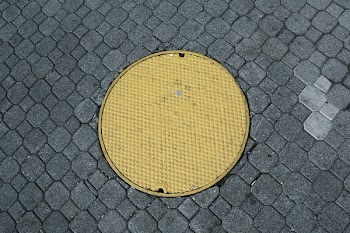 Free Photo of yellow, manhole, cobblestone