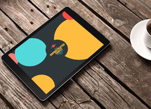 Free Sophisticated Tablet Mock-up on Wooden Background 