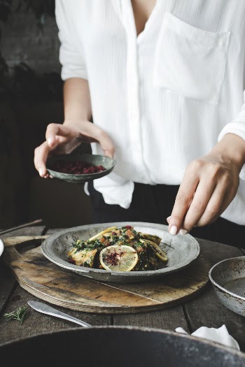 Free woman seasoning her meal | Free Photo - rawpixel