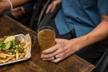 French Fries and a Glass Filled with Beer