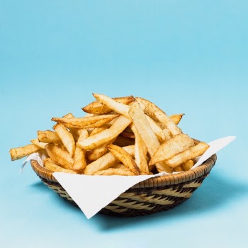 French fries on blue background Free Photo