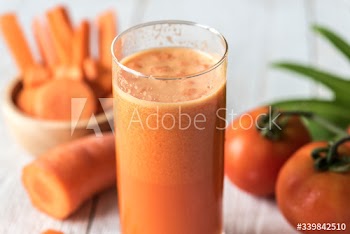 Fresh carrot juic macro shot