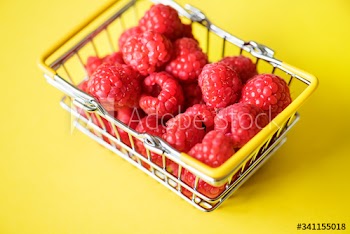 Fresh raspberries in a mini basket