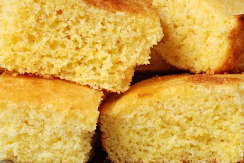 Freshly baked cornbread cut into squares.