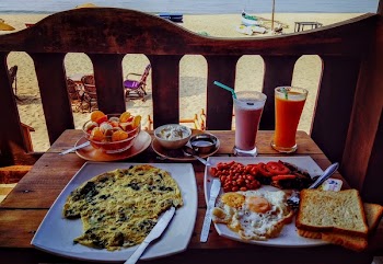 Fried Egg and Egg Omelet on Plate