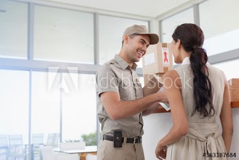 Friendly deliveryman delivering packages to woman