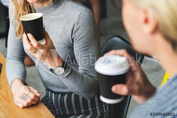 Friends enjoying a hot coffee together