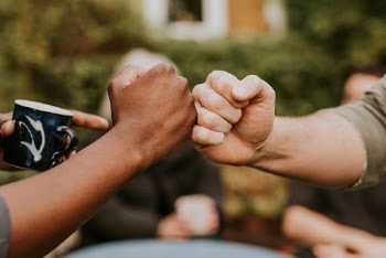 Friends fist bumping at a party | Free Photo - rawpixel