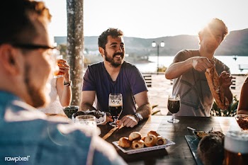Friends having dinner outdoors