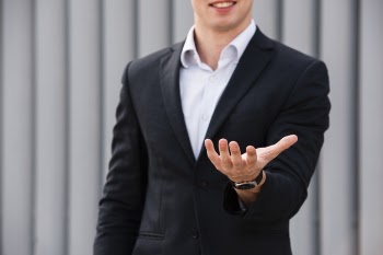 Front view businessman holding hand out Free Photo