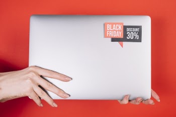 Front view laptop with black friday sticker Free Photo
