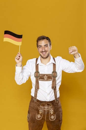 Front view of man holding german flag Free Photo