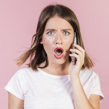 Front view shocked girl on the phone Free Photo