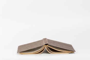 Front view upside down book with white background Free Photo