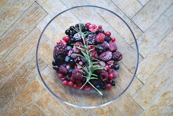 Frozen berries on a wooden floor 