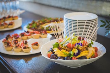 Fruit Salad in White Ceramic Bowl Near Plates