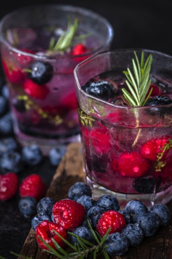 Fruits In Two Glasses With Liquid 