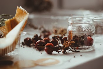 Fruits on White Surface and Jar