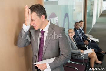 Frustrated businessman leaving job interview
