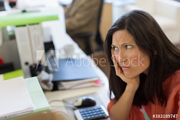Frustrated businesswoman in office