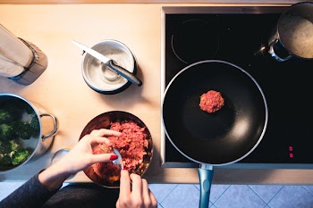 Frying ground beef burger meat 