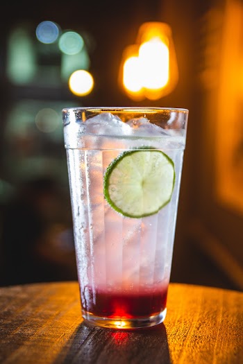 Full Clear Drinking Glass With Sliced Lemon