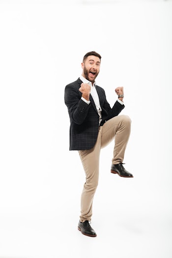 Full length portrait of a cheery happy man celebrating success Free Photo