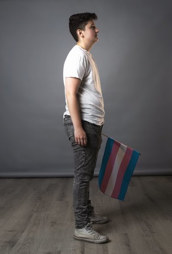 Full Side View Of Person Holding Trans Pride Flag
