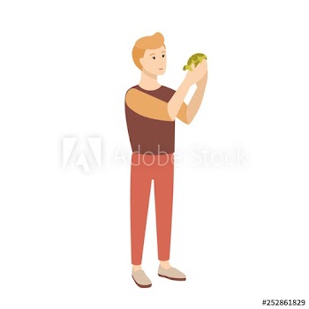 Funny young man or teenage boy holding tortoise or turtle