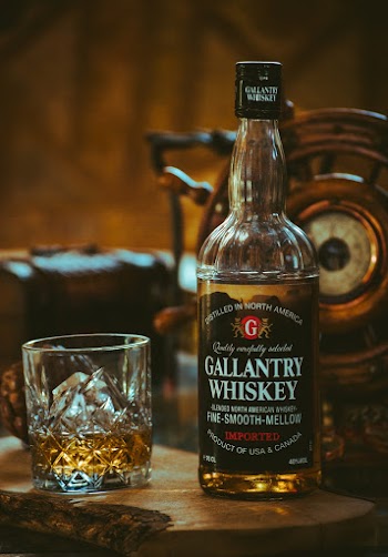 Gallantry Whiskey Bottle Beside Glass 